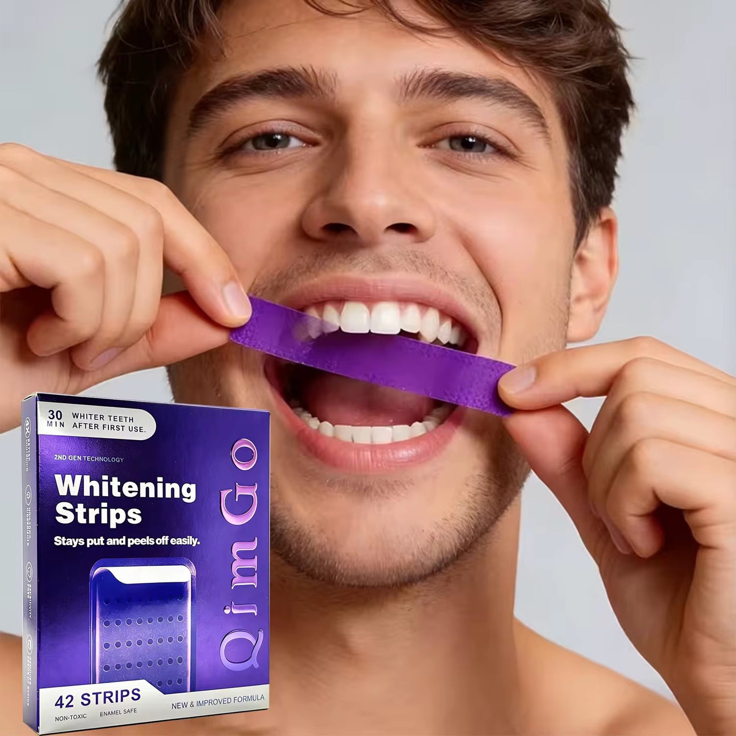 Man applying QimGo whitening strip to teeth
